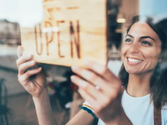 Small business owner celebrating being open